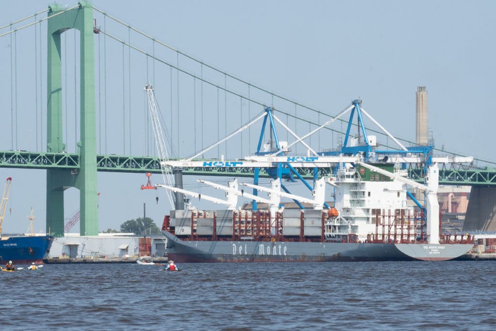 Unloading fruit below the Walt Whitman Bridge