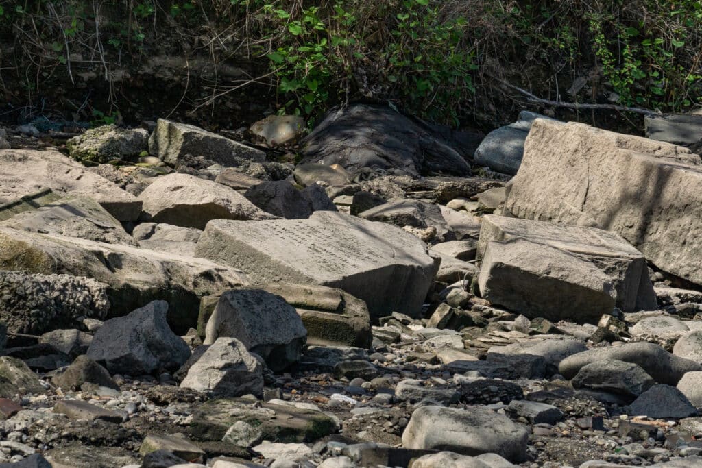 Late 19th century gravestones used to form a protective rip rap beneath the Betsy Ross Bridge.